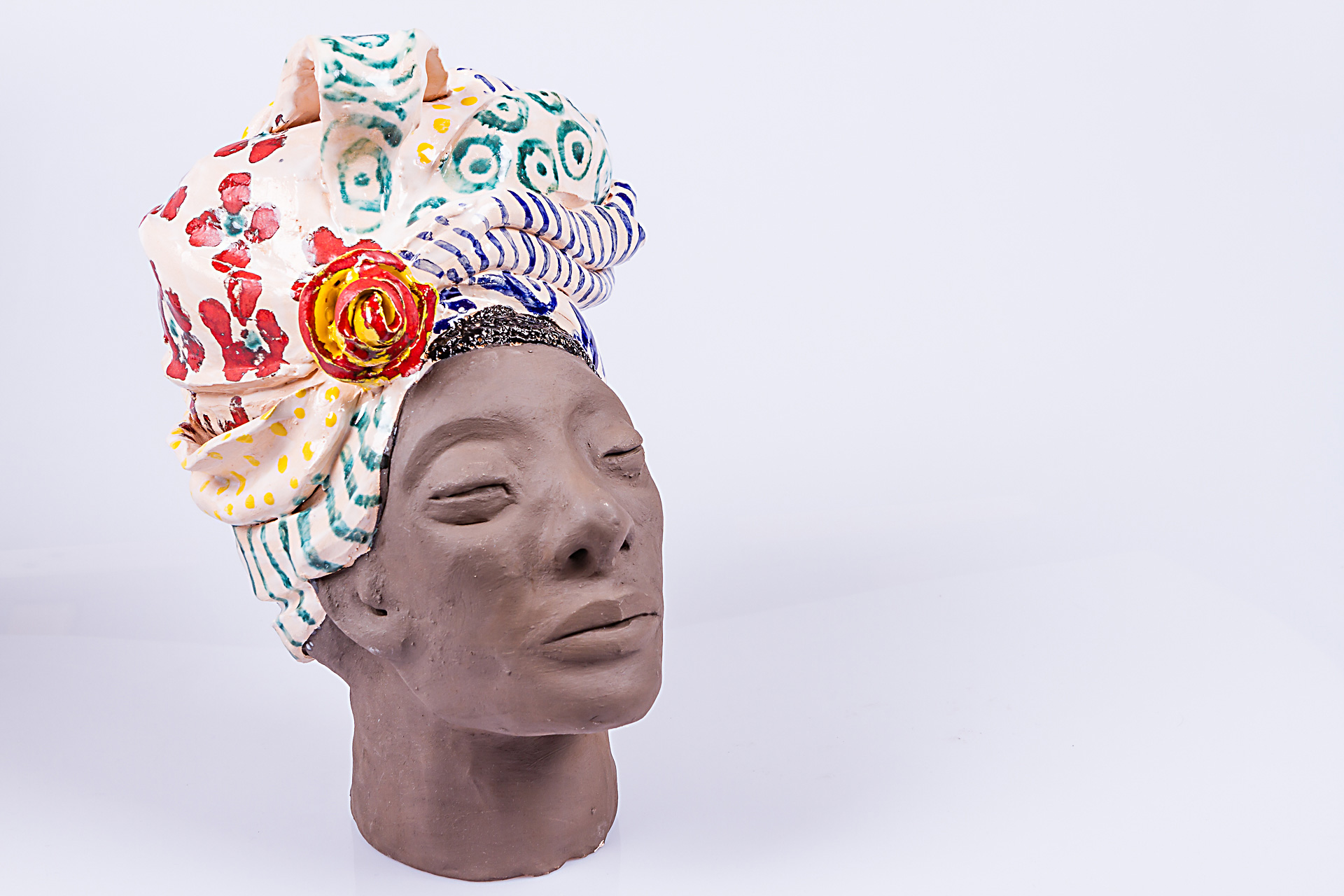 Cabeça com turbante e flores - Ver mais Esculturas Modeladas